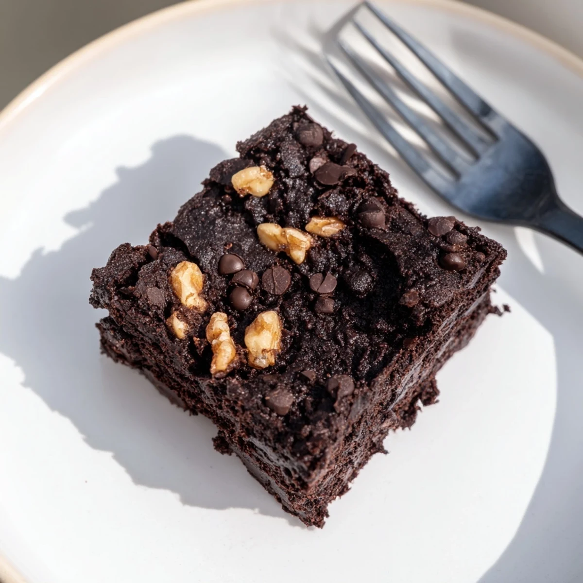 Enjoy rich, gooey brownies using leftover nut-milk pulp for minimal waste.  