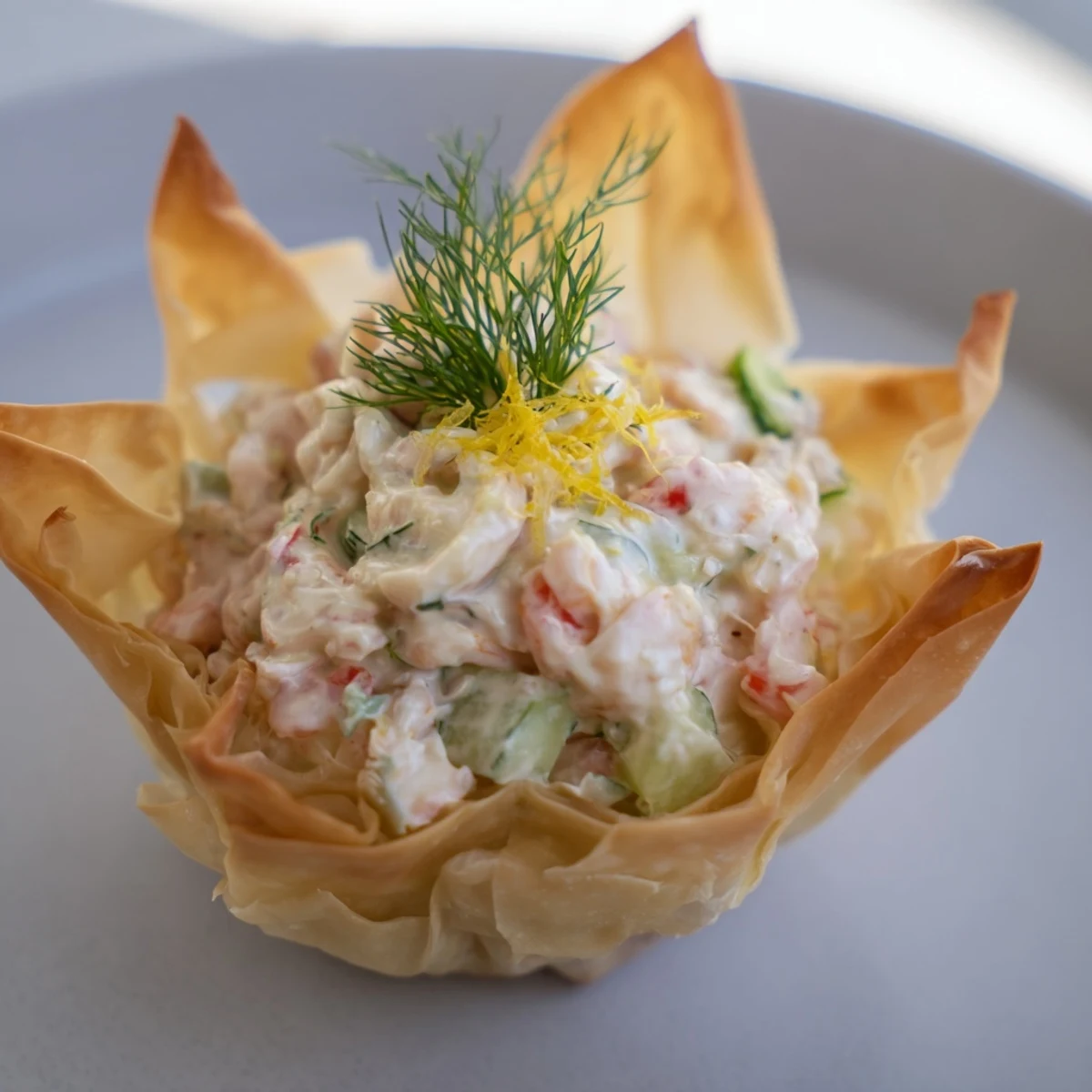 Golden, flaky Mini Star Cocktail Cups filled with savory shrimp salad, a perfect bite.