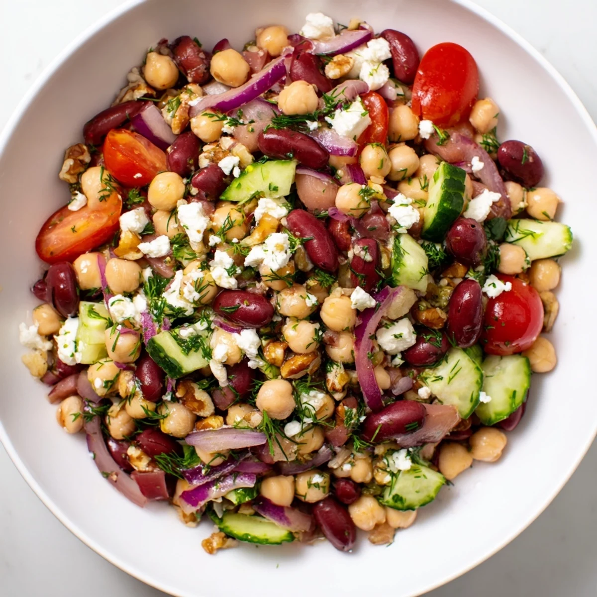 Vibrant Dense Bean Salad, tossed with tart cherry dressing, ready to serve with optional feta.