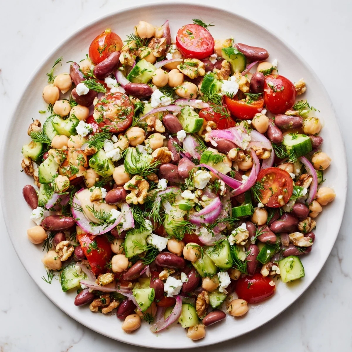 Freshly tossed Dense Bean Salad showcasing colorful vegetables, perfect for a healthy supper.