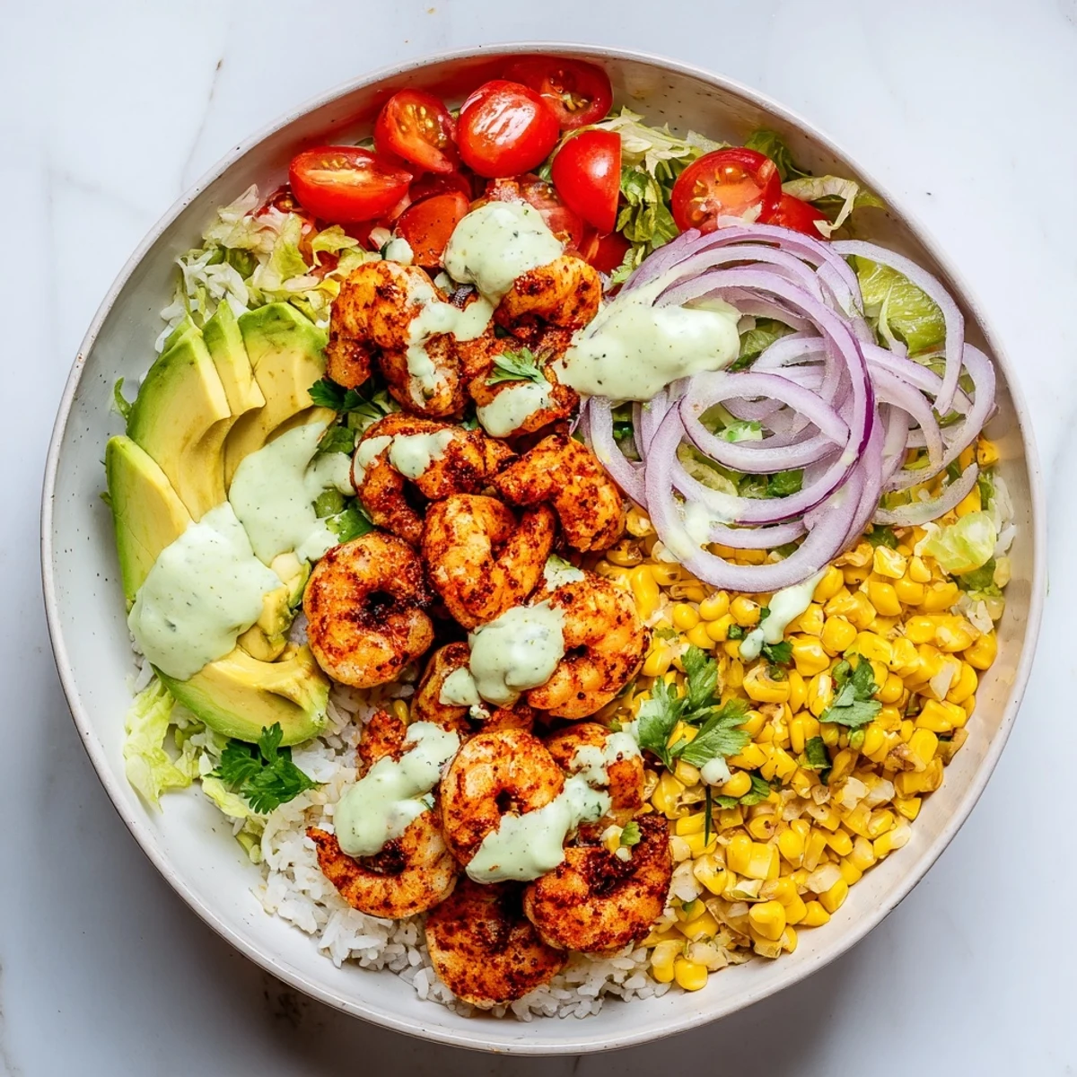 This image shows a beautifully arranged Cajun Shrimp Taco Bowl, ideal for a gluten-free dinner.