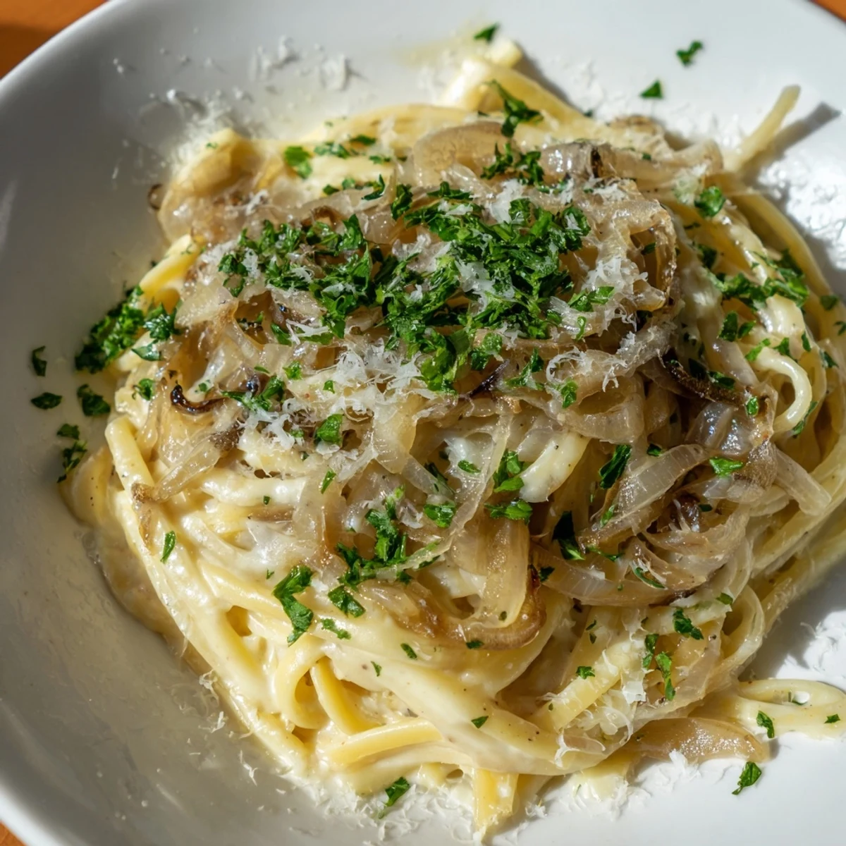 Melting Gruyère cheese blankets the creamy One-Pot French Onion Pasta, a hearty main course.