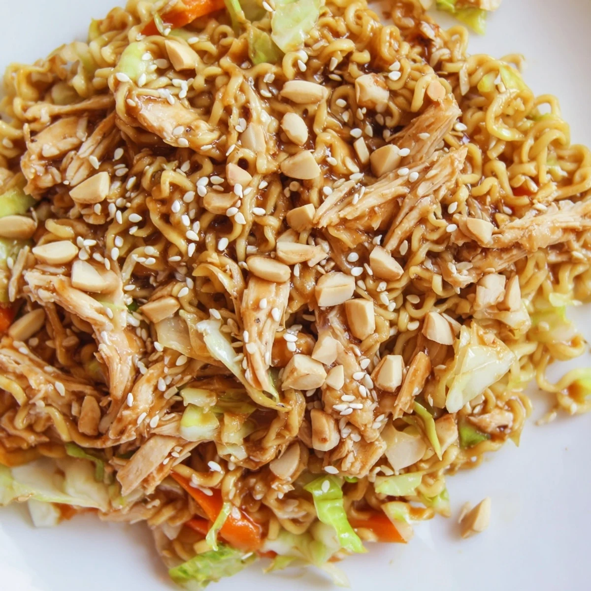 Shredded cabbage and tender rotisserie chicken tossed with crunchy ramen noodles and almonds in a sweet sesame dressing.