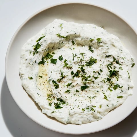 A vibrant photo shows Greek Yogurt Ranch Dip, ready to be scooped up with crunchy carrots.