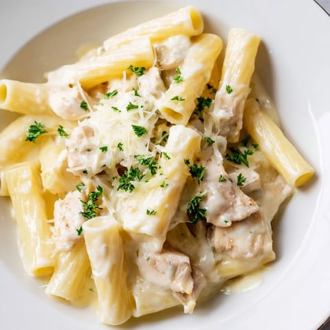 Golden-topped Chicken Alfredo Bake, with bubbly cheese, creamy sauce, and inviting Italian flavors.