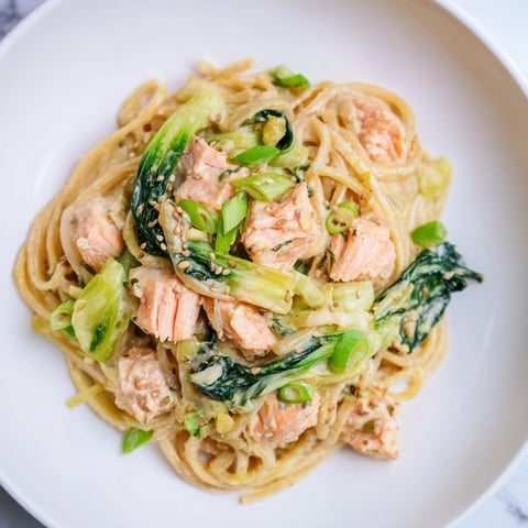 Plate of creamy Miso Butter Salmon Pasta with bok choy, ready for a delicious dinner.