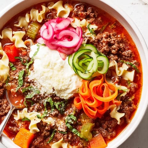 Hearty lasagne soup sprinkled with pickled veggies for extra crunch and flavor.  