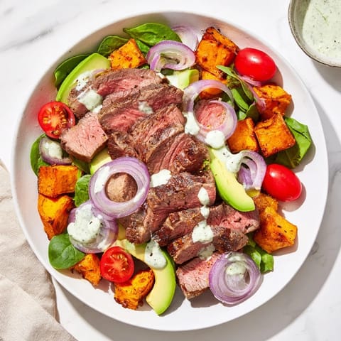 Warm roasted sweet potatoes and seared beef in this delicious Beef Avocado Sweet Potato Bowl.