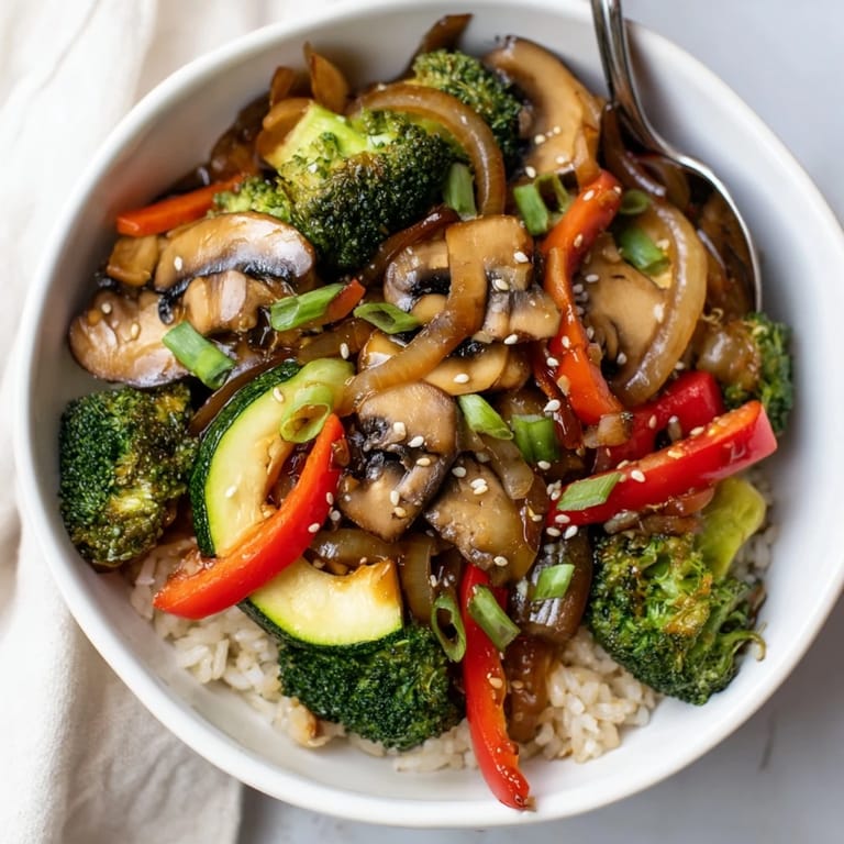 Sizzling hibachi veggie bowls filled with fresh vegetables and savory garlic-ginger sauce.  
